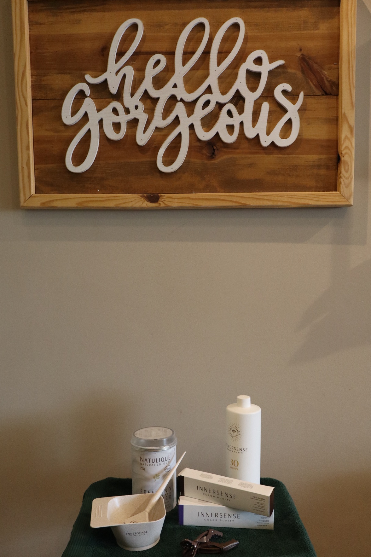 Hello Gorgeous sign and Innersense products at Tangles Salon